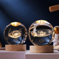 USB-powered crystal ball with 3D engraved galaxy, warm LED light, perfect for home decor or as a nightlight.